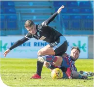  ??  ?? ICT’S Brad M ckay slides in to tackle St M irren’s Kyle M agennis