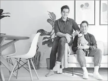  ?? Seth Wenig Associated Press ?? ZACHARIAH MOHAMMED, left, and Pete Mancilla in their New York apartment, where most of the furniture is rented. Start-ups such as Feather and Fernish cater to those who don’t want to buy or move big items.