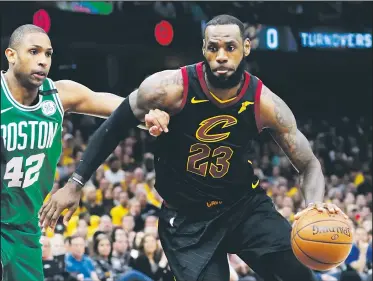  ?? AP/TONY DEJAK ?? Cleveland Cavaliers’ LeBron James (left) drives past Boston Celtics’ Al Horford Monday in Cleveland.