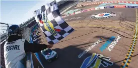  ?? (Chris Graythen/getty Images) ?? William Byron, driver of the #24 Valvoline Chevrolet, takes the checkered flag to win the Cup Series United Rentals Work United 500 at Phoenix Raceway Sunday.