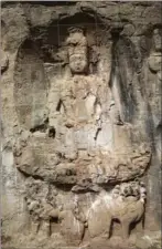  ?? PHOTOS PROVIDED TO CHINA DAILY ?? Left: The cliff engravings of the Vairochana Buddha in the Para village of Markham county’s Gartok township in the Tibet autonomous region. Right: Petroglyph­s found in Markham’s Garthok township.