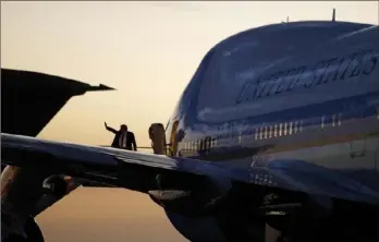  ?? Patrick Semansky/Associated Press ?? President Donald Trump waves as he boards Air Force One at Tampa Internatio­nal Airport in Tampa, Fla., on Friday.