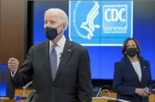  ?? Patrick Semansky/Associated Press ?? President Joe Biden speaks as Vice President Kamala Harris listens during a COVID-19 briefing at the Centers for Disease Control and Prevention headquarte­rs Friday in Atlanta.