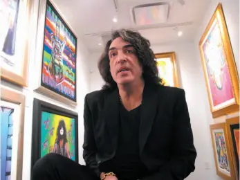  ?? AP PHOTO ?? Paul Stanley, singer and guitarist for the rock group Kiss, speaks during a Saturday interview among his artwork at a gallery in Atlantic City, N.J.