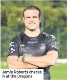  ??  ?? Jamie Roberts checks in at the Dragons