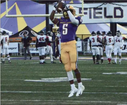  ?? BY JOE BOYLE JBOYLE@DIGITALFIR­STMEDIA.COM @BOYLERALER­TTROY ON TWITTER ?? Dev Holmes goes up for a catch in warm ups Saturday night, September 22, at Bob Ford Stadium at UAlbany.