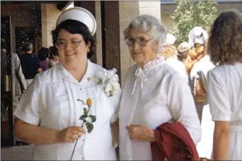  ?? PHOTOS COURTESY OF CSUB, ?? An unidentifi­ed early CSUB nursing graduate at her pinning ceremony poses with her aunt.