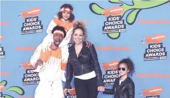  ?? AP FOTO ?? THE CANNONS. Nick Cannon and Mariah Carey with children Moroccan and Monroe.