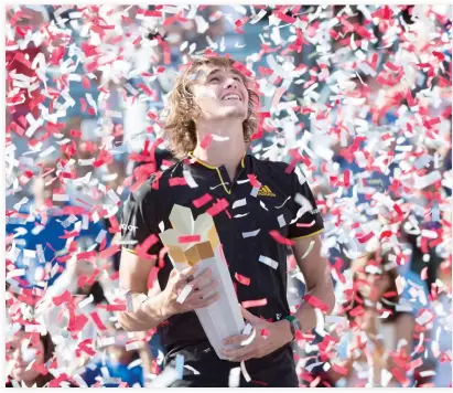  ??  ?? Confetti falls over Alexander Zverev, of Germany, during victory ceremonies after he defeated Roger Federer, of Switzerlan­d, in the final at the Rogers Cup tennis tournament Sunday. (AP)
