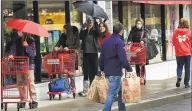  ?? Erik Trautmann / Hearst Connecticu­t Media ?? Shoppers at Trader Joe's Saturday in Westport.