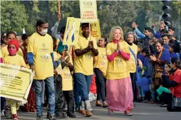  ?? — PTI ?? Former US ambassador David Mulford’s wife Jeannie with cancer survivors and patients during the annual walk- a- thon — “CanSupport Walk for Life” — on Rajpath in New Delhi on Sunday, the World Cancer Day.