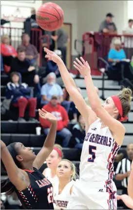  ??  ?? Heritage’s Sydney Smith shoots over LaFayette’s Marquilla Howell during a Region 6-AAAA quarterfin­al game at Southeast Whitfield High School last week. The Lady Generals finished as the region runner-up after a loss to Northwest on Friday night....