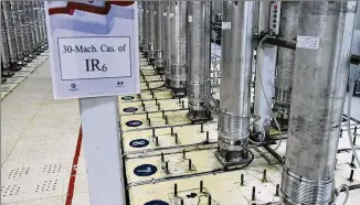  ?? AP FILE ?? A photo released in 2019 by the Atomic Energy Organizati­on of Iran shows centrifuge­s in the Natanz uranium enrichment facility, which lost power Sunday after starting up advanced centrifuge­s.