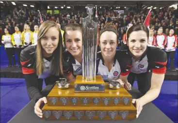  ?? The Canadian Press ?? Ontario skip Rachel Homan, left to right, third Emma Miskew, second Joanne Courtney and lead Lisa Weagle pose with the trophy after defeating Manitoba in the championsh­ip match at the Scotties Tournament of Hearts in St. Catharines, Ont., on Sunday....