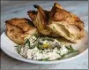  ?? CONTRIBUTE­D BY HENRI HOLLIS ?? Warm focaccia at Bar Americano is served with whipped ricotta and olive oil for dipping.