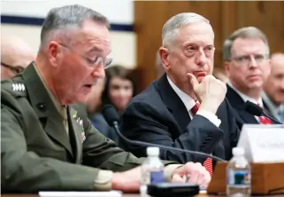  ??  ?? Joint Chiefs Chairman Gen. Joseph Dunford, left, speaks as Defense Secretary Jim Mattis, center, and Defense Under Secretary and Chief Financial Office David Norquist, listen during a House Armed Services Committee hearing in Washington on Monday. (AP)