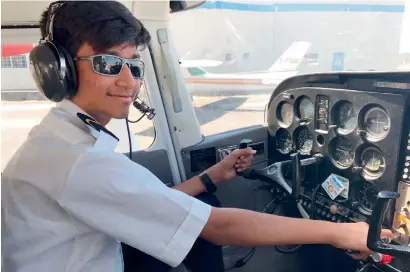  ??  ?? Mansoor Anis during his first solo flight in a Cessna 152 in Canada. He broke the record for the least training time taken by a young pilot.