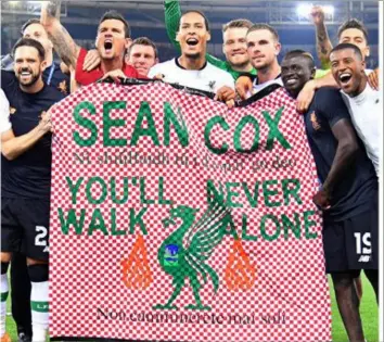  ??  ?? Liverpool players pay tribute to Sean Cox in Rome last Wednesday after their semi final victory.