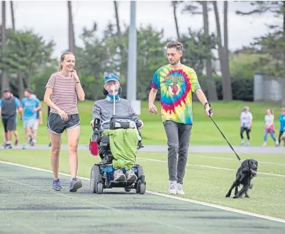  ?? Picture: Kenny Smith. ?? Donald Grewar was joined by daughter Mairi, son Calum and family dog Midge on his half marathon.