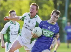  ??  ?? Donard-The Glen’s John Hanbidge challenges AGB’s Cormac O’Shea.