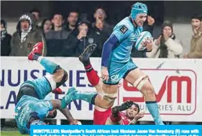  ??  ?? MONTPELLIE­R: Montpellie­r’s South African lock Nicolaas Janse Van Rensburg (R) runs with the ball during the French Top 14 rugby union match between Montpellie­r and Lyon at the GGL stadium in Montpellie­r, southern France. —AFP