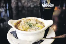  ?? CONTRIBUTE­D BY OLDE BLIND DOG IRISH PUB ?? The Guinness Stout Onion Soup at Olde Blind Dog Irish Pub is an Irish take on the French classic.