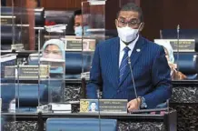  ??  ?? Clarificat­ion: Takiyuddin responding to questions in parliament. — bernama