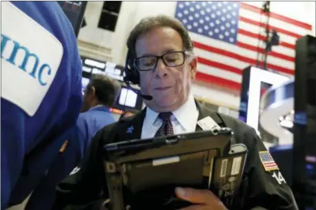  ?? RICHARD DREW — THE ASSOCIATED PRESS ?? Trader Sal Suarino works on the floor of the New York Stock Exchange, Tuesday.