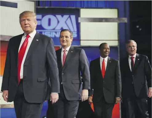  ?? ANDREW BURTON / GETTY IMAGES ?? Republican presidenti­al nomination candidates, from left, Donald Trump,
Ted Cruz, Ben Carson and Jeb Bush arrive at Thursday’s debate.