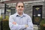  ?? TANIA SAVAYAN/THE JOURNAL NEWS VIA AP, FILE ?? In this 2018 file photo, Irvington police officer Arcangelo Liberatore poses for a photo in Irvington, N.Y. Liberatore, who rescued a 5-year-old girl from a rabid coyote at a New York playground, is one of 19 people being honored with Carnegie Medals for heroism.