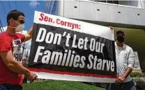  ?? Mark Mulligan / Staff file photo ?? Demonstrat­ors protest in Houston this month. The protest involved a food distributi­on for jobless hospitalit­y workers.