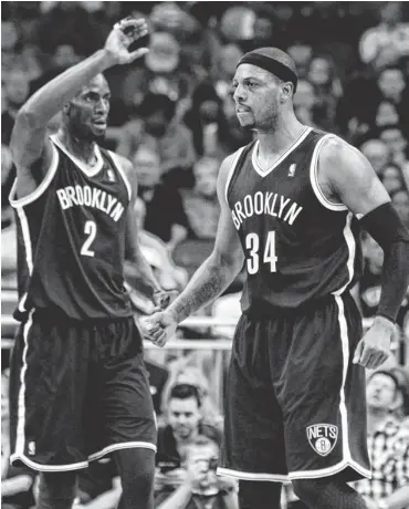  ?? KIM KLEMENT, USA TODAY SPORTS ?? Forwards Kevin Garnett, left, and Paul Pierce are finding their way with the Nets after spending the previous six seasons as Celtics teammates. They won an NBA title with Boston in 2008.
