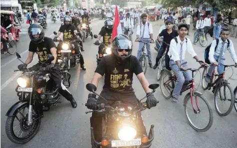  ?? — AFP ?? A group of commandos of National Security Guard ride on their motorcycle­s during an awareness rally to fight against terror in Allahabad, Uttar Pradesh, on Wednesday.