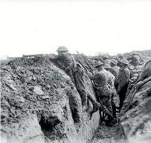  ?? ALEXANDER TURNBULL LIBRARY ?? Equipment on, bayonets fixed, and ready to go. New Zealand troops prepare to attack on the Western Front.