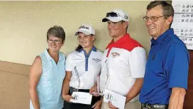  ?? [PHOTO BY JACOB UNRUH, THE OKLAHOMAN] ?? Olive’s Alexis Matlock and Plainview’s Saxon Ross hold the Kyle Lewis Memorial Scholarshi­p Awards on Monday. Lewis’ parents, Kelly, left, and Marty, right, presented the awards.