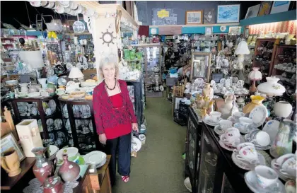  ??  ?? Vivien Gerrand, of Arkwrights Antiques, is one of the retailers flourishin­g in the present Covid-19 climate as Kiwis are spending their money locally.