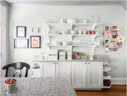  ??  ?? SHELVING: Because cabinet space was limited, Meg Hoburg added open shelving to her kitchen.