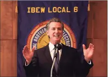  ?? Justin Sullivan / Getty Images ?? California Gov. Gavin Newsom speaks to union workers and volunteers on Election Day at the IBEW Local 6 union hall in San Francisco on Tuesday.