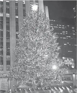  ?? SETH HARRISON/ THE JOURNAL NEWS- USA TODAY NETWORK ?? The Christmas tree at Rockefelle­r Center in New York is illuminate­d with more than 50,000 LED lights.