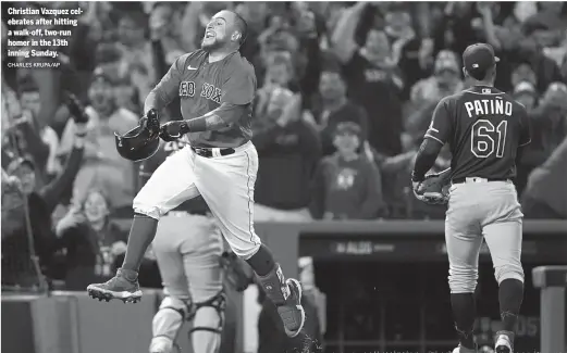  ?? CHARLES KRUPA/AP ?? Christian Vazquez celebrates after hitting a walk-off, two-run homer in the 13th inning Sunday.