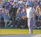  ?? ASHLEY LANDIS/AP ?? SCOTTIE SCHEFFLER celebrates after a birdie on the 18th hole during third round at the Masters tournament at Augusta National Golf Club on Saturday in Augusta, Ga.