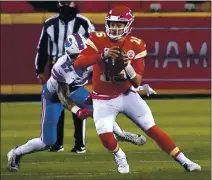  ?? JEFF ROBERSON — THE ASSOCIATED PRESS ?? Chiefs QB Patrick Mahomes, who passed for 3 TDs, scrambles ahead of Bills defensive end AJ Epenesa in Sunday’s AFC Championsh­ip game.