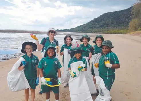  ??  ?? CLEAN-UP: Trinity Anglican School students Philippa Smith, Vinuka Gamage, Kim Greaves (teacher), Ella Greenwood, Khyati Shrivastav­a, Matilda Hancock, Alyssa Atfield and Miranda Liria do their bit to help the environmen­t at East Trinity’s Giangurra Beach.