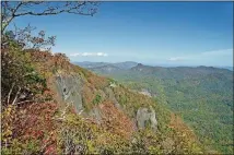  ?? CONTRIBUTE­D BY MARY ANNE BAKER ?? Georgians looking for fall colors can make a little trip out of it. In Jackson County, N.C., Whiteside Mountain (shown in a file photo) is known for offering glorious colors. It is peaking now.