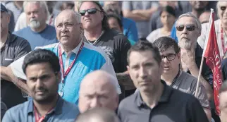  ?? CHRIS YOUNG/THE CANADIAN PRESS ?? Workers at a Bombardier plant in Toronto listen to Unifor national president Jerry Dias speak Wednesday amid mounting calls for Boeing to drop a trade complaint against Bombardier. Bombardier rejected claims that it is not co-operating with the probe.