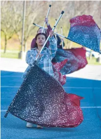  ?? AMY SHORTELL/THE MORNING CALL PHOTOS ?? Dayanara Juarez marches as part of the color guard as the Parkland High School Trojan Marching Band.
