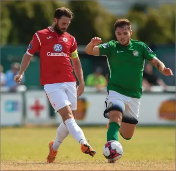  ??  ?? Kyle McFadden of Sligo Rovers closes in on Ger Pender of Bray Wanderers.