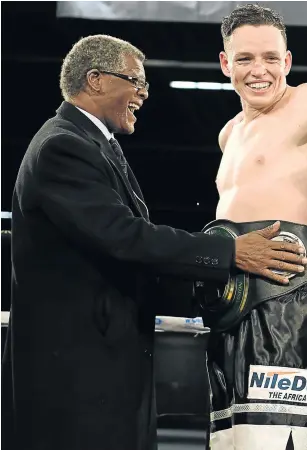  ?? Picture: GALLO IMAGES/LEFTY SHIVAMBU ?? PAY NOW, FIGHT LATER: BSA chair Dr Peter Ngatane, left, with Rowan Campbell SA super-middleweig­ht title. Ngatane-led board has gone back to the thorny issue of demanding tournament­s funds two weeks in advance.