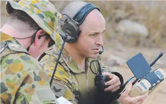  ?? HIGH STANDARD: Bombardier David Johnson of JTAC Troop Air Land Regiment and Bombardier David Allen of 8/ 12th Medium Regiment call in aircraft during Exercise Nigrum Pugio. ??