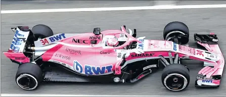  ??  ?? Force India F1-Mercedes Team’s Russian driver Dimitry Mazepin drives at the Circuit de Catalunya on Monday. Force India unveiled its new car —VJM11 — for the 2018 season, hours ahead of first testing. The car has eye-catching and dynamic livery,...